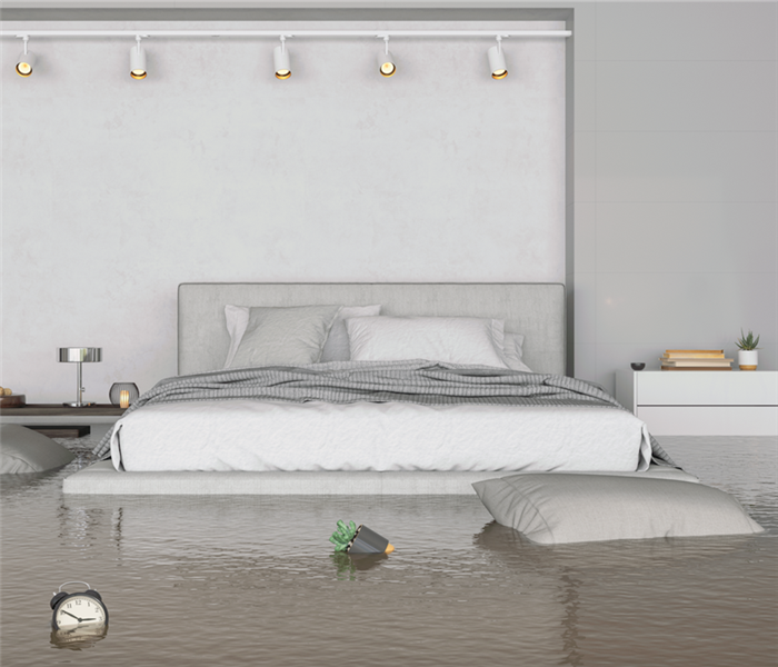 flooded bedroom with queen size bed