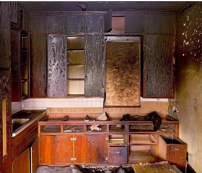 smoke damaged kitchen; charred cabinets